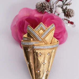 Broche dorée Valentino